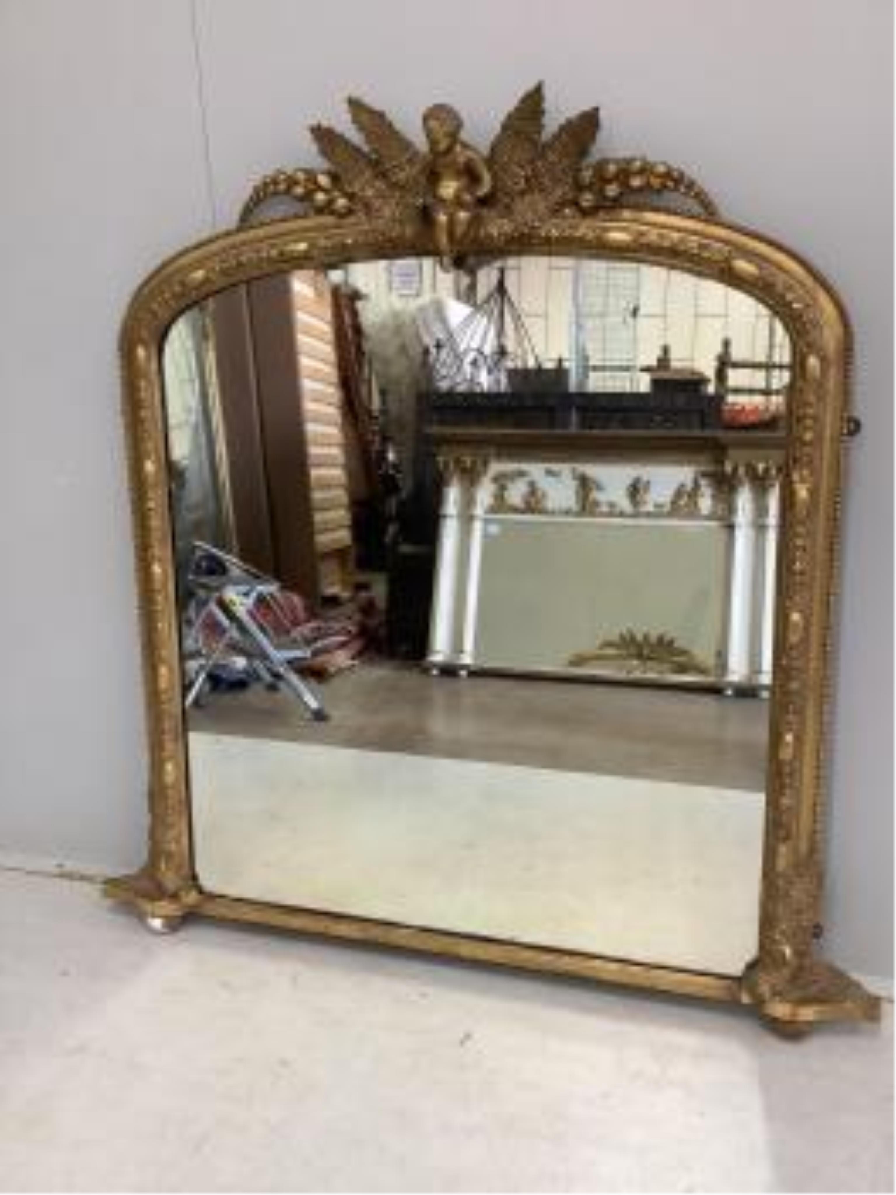 A Victorian giltwood and composition overmantel mirror, width 116cm, height 119cm